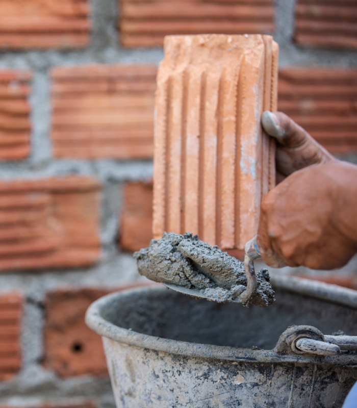 Construction de mur en parpaings et alignement de blocs béton en maçonnerie ABC du Bâtiment